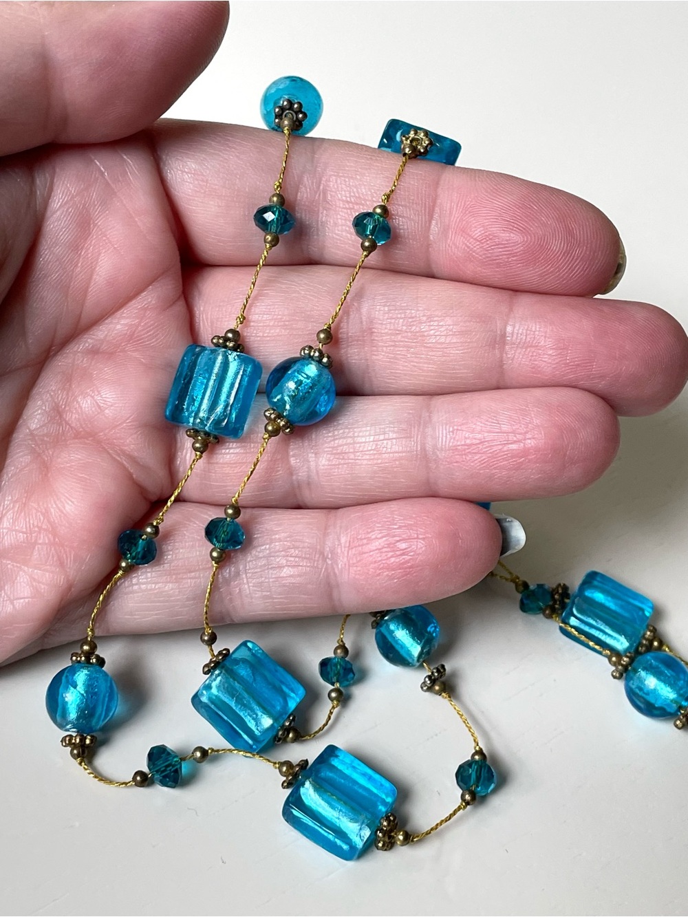 Vintage goldtone & foiled blue art glass station necklace Venetian-style